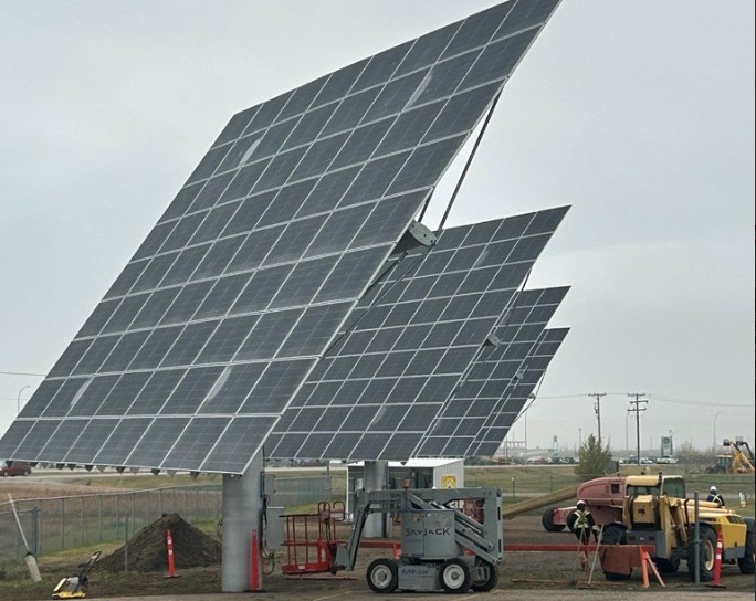 Solar arrays integrated with industrial facility in daylight